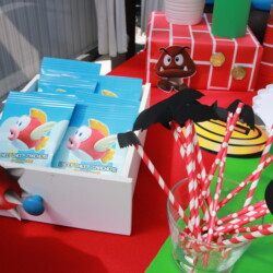 A table with some cups and straws on it