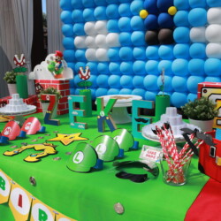 A table with balloons and decorations on it