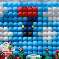 A balloon wall with mario characters on it