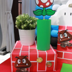 A red brick cake with mario characters on it.