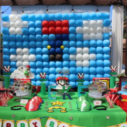 A table with balloons and decorations on it