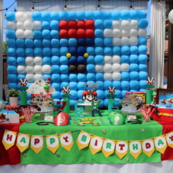 A table with balloons and decorations on it