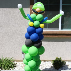 A balloon sculpture of a person with arms outstretched.