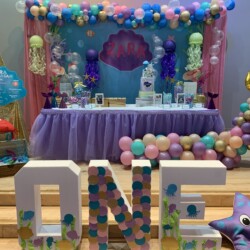 A birthday party with balloons and decorations