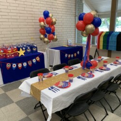 A table with balloons and decorations on it