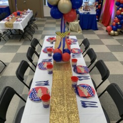 A table with chairs and balloons on it