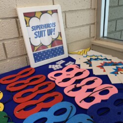 A table with many different colored paper cut outs.