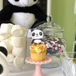 A panda bear cake on top of a cupcake.