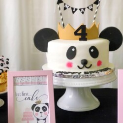 A panda cake with a crown on it