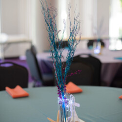 A table with a vase of flowers on it
