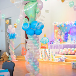 A room filled with balloons and decorations.