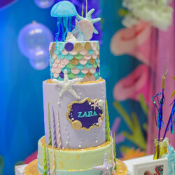 A cake with the name zaba on it.