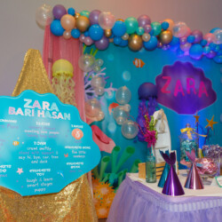 A table with balloons and decorations on it