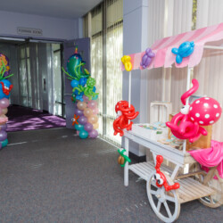 A room with balloons and decorations on the walls.