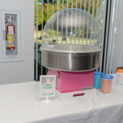 A table with a pink and silver machine on it