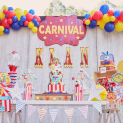 A carnival themed birthday party with balloons and decorations.