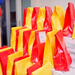 A table with many bags of food on it