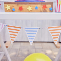A table with bunting and balloons on it